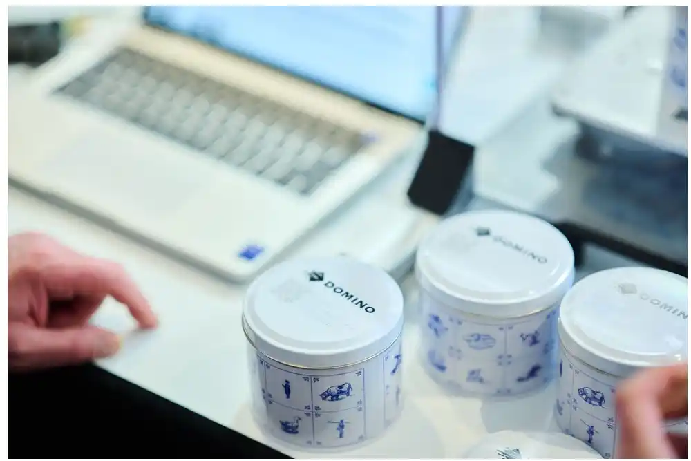 showing domino's product packaging while adding data to the cloud